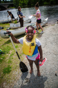 child with paddle