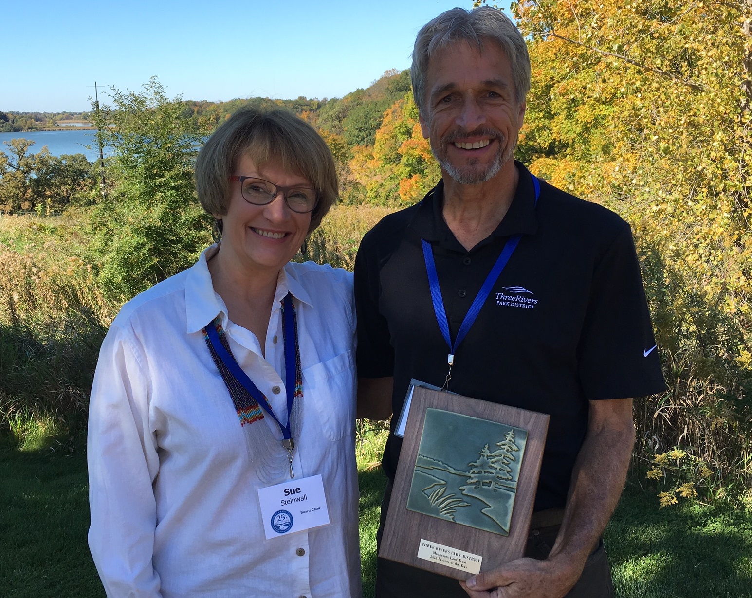 Sue Steinwall, Land Trust Board Chair with Tom Dowell, Associate Superintendent of the Three Rivers Park District, Partner of the Year