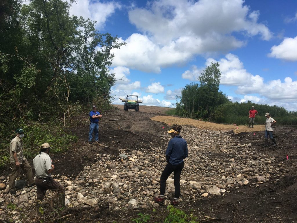 Wetland restoration designs are based on a wetland basin's hydrology. A rock spillway was required with the installed ditch plug to prevent erosion.