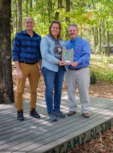 Kris Larson, Executive Director with the 2021 Partner of the Year, Camp Olson YMCA Board President, Jenny Sall and Executive Director Russ Link
